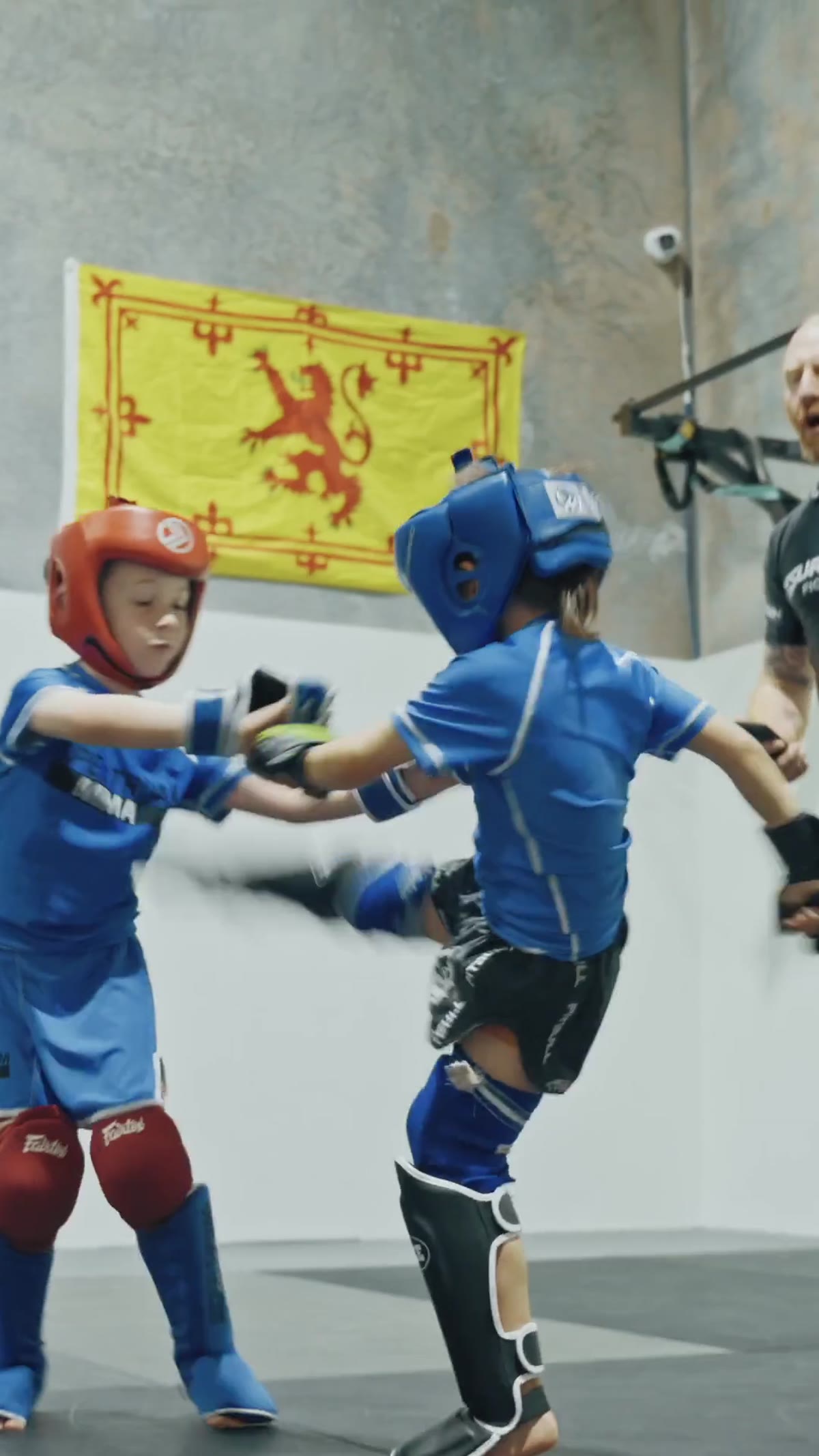 Kids MMA — roundhouse on the pads