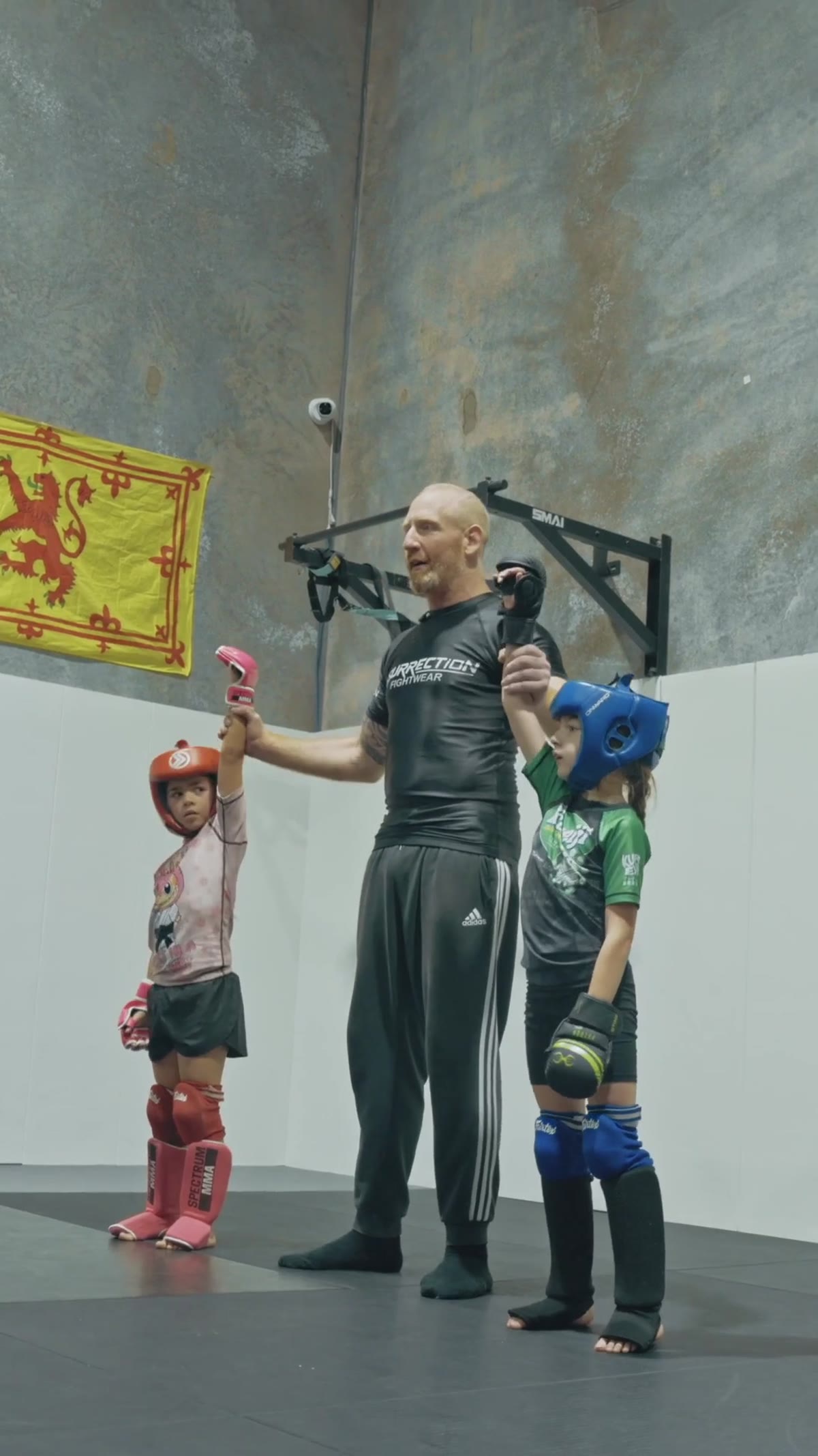 Kids MMA with the coach after the round