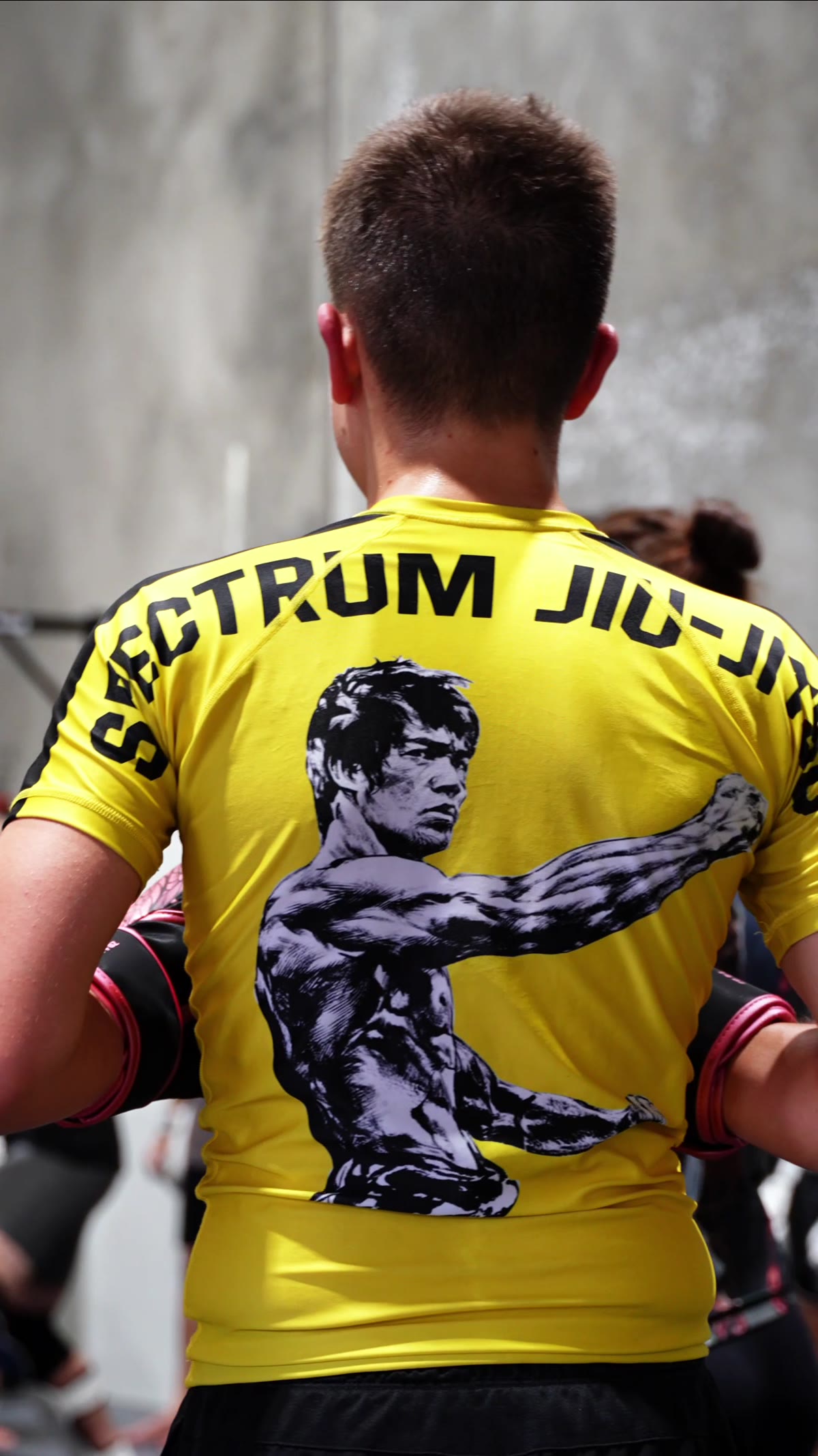 Spectrum rashguard on the mats